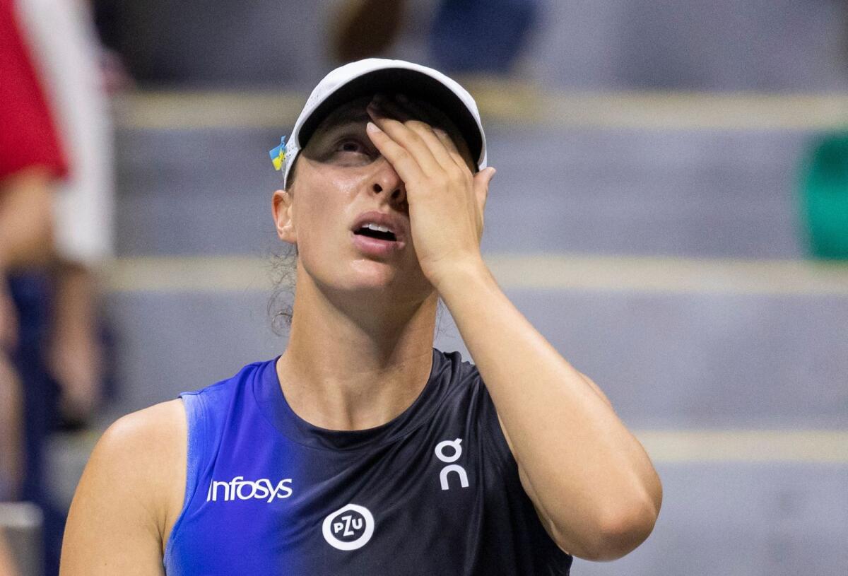 Poland's Iga Swiatek reacts during her match against Latvia's Jelena Ostapenko. — AFP