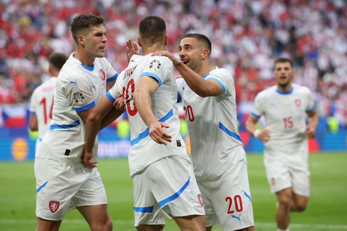 Czech Republic's Patrik Schick (centre) celebrates with teammates after scoring a goal against Georgia. — AFP