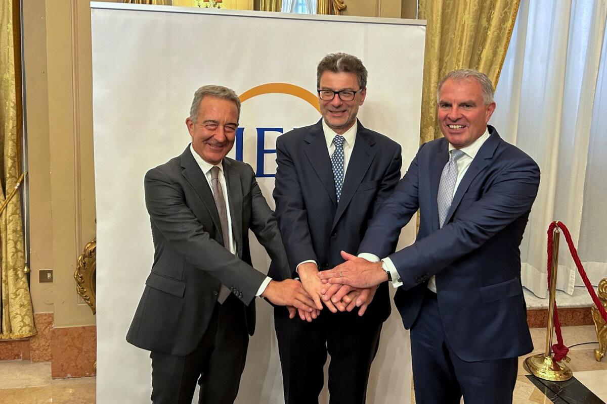 ITA Airways chairman Antonino Turicchi, Italy's Economy Minister Giancarlo Giorgetti and Lufthansa chief executive Carsten Spohr pose for a photo in Rome, Italy, July 3. — Reuters