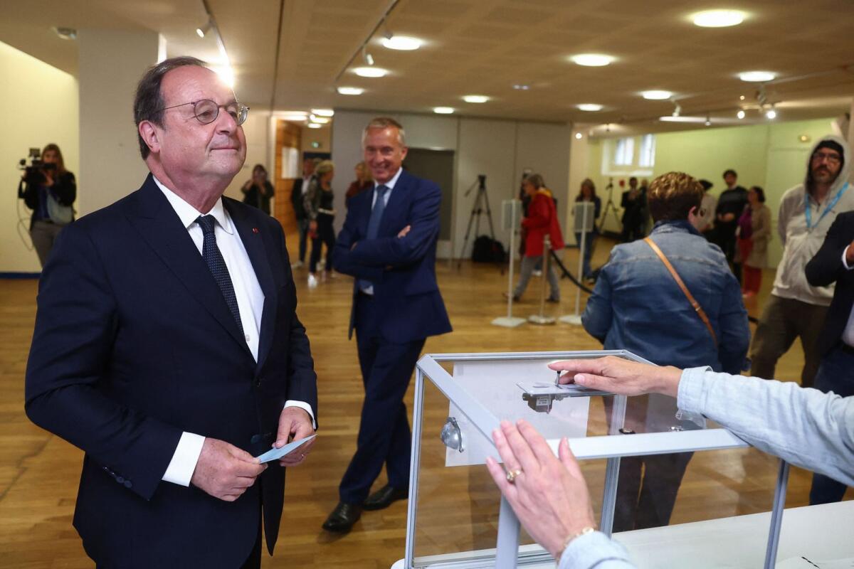 Francois Hollande, former French president and candidate for the left-wing political alliance called Nouveau Front Populaire (New Popular Front - NFP), prepares to cast his ballot to vote in the first round of the early French parliamentary elections at a polling station in Tulle, France, on Sunday. — Reuters