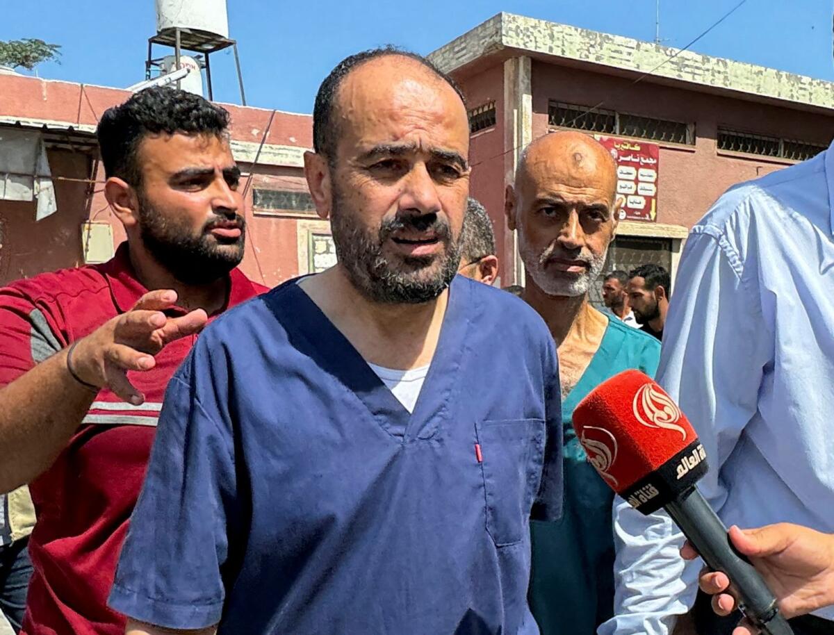 Palestinian doctor Mohammed Abu Salmiya, the director of Al Shifa Hospital who was detained by Israeli forces, walks after his release from an Israeli jail on Monday. — Reuters