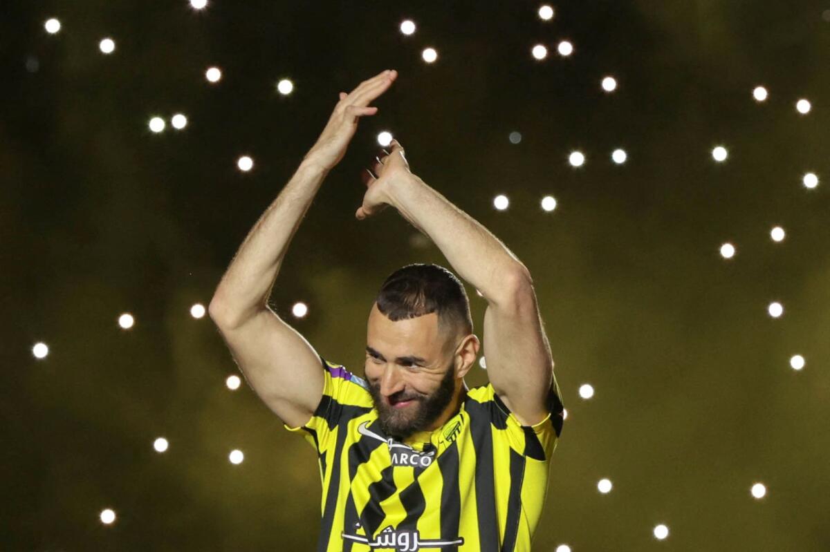 French forward Karim Benzema greets the crowd during his unveiling at King Abdullah Sports City stadium in Jeddah, on June 8, 2023. - AFP