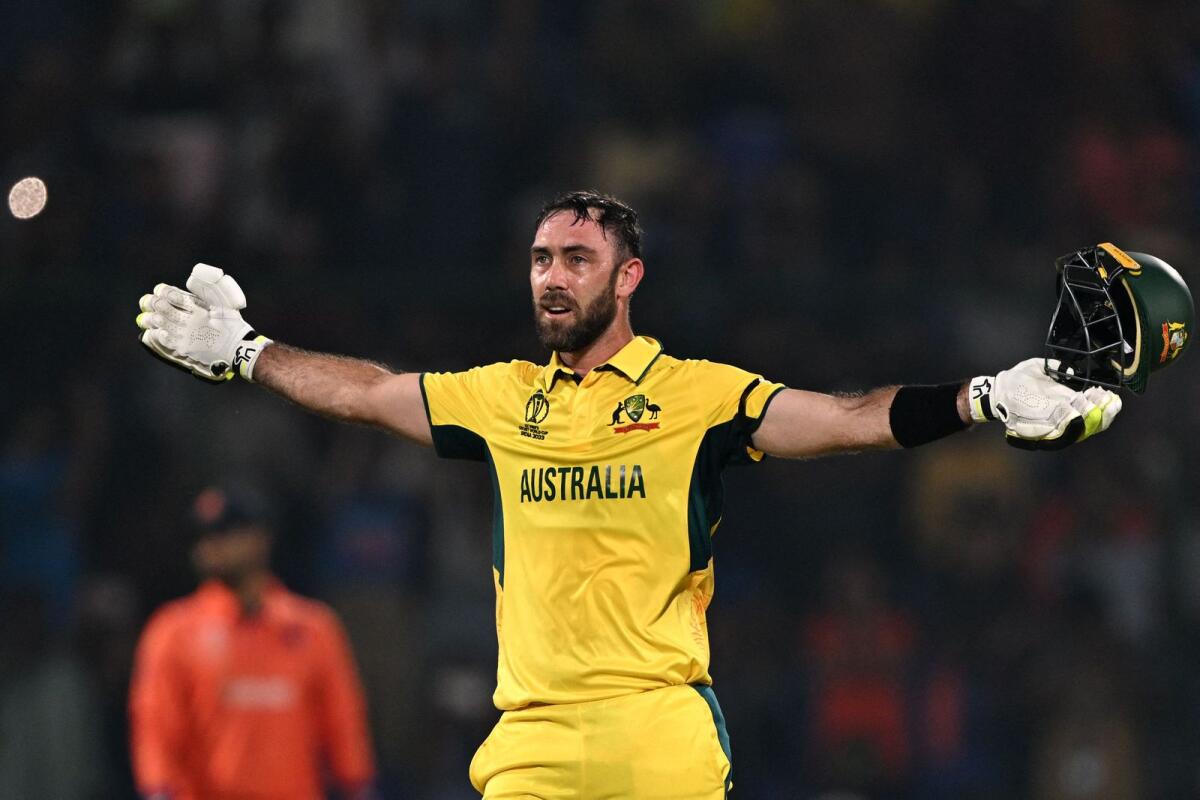Australia's Glenn Maxwell celebrates after scoring a century against the Netherlands. — AFP