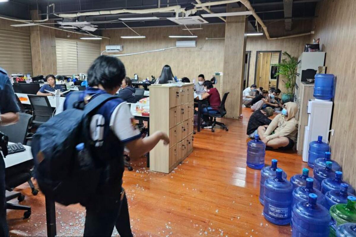 In this photo provided by the Philippine National Police Anti-Cybercrime Group, police walks inside one of the offices they raided in Las Pinas, Philippines, on June 27, 2023.  — AP file