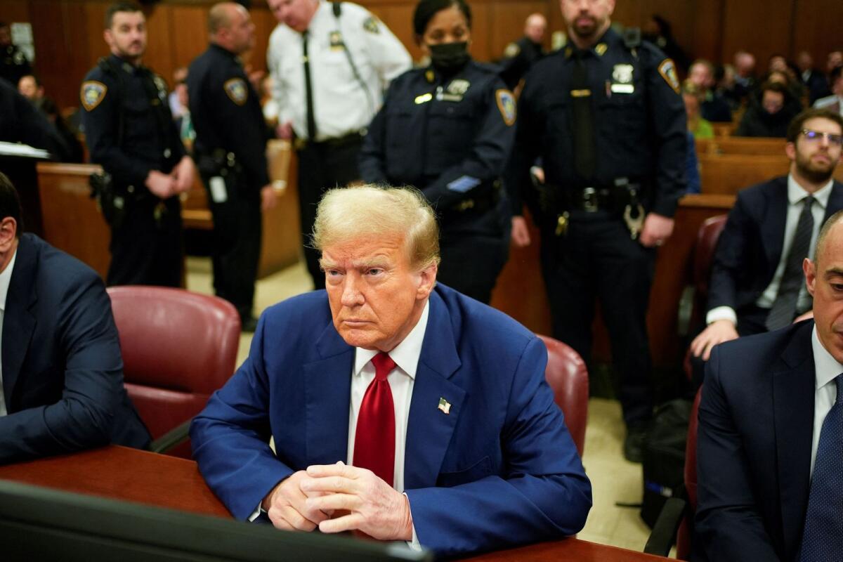 Former president Donald Trump awaits the start of proceedings at Manhattan criminal court on Tuesday. — reuters
