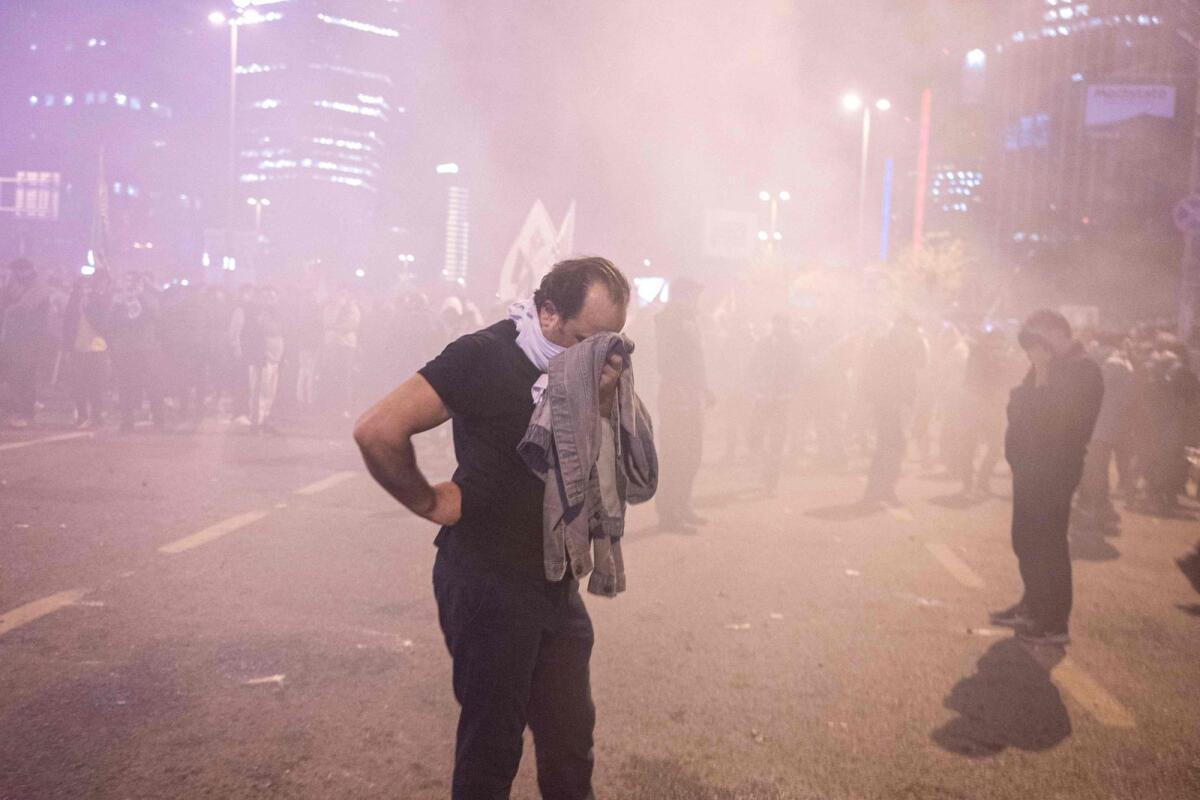 People clash with anti-riot policemen outside the Israeli consulate during a protest to show solidarity with Palestinians, in Istanbul early on October 18, 2023. Photo: AFP