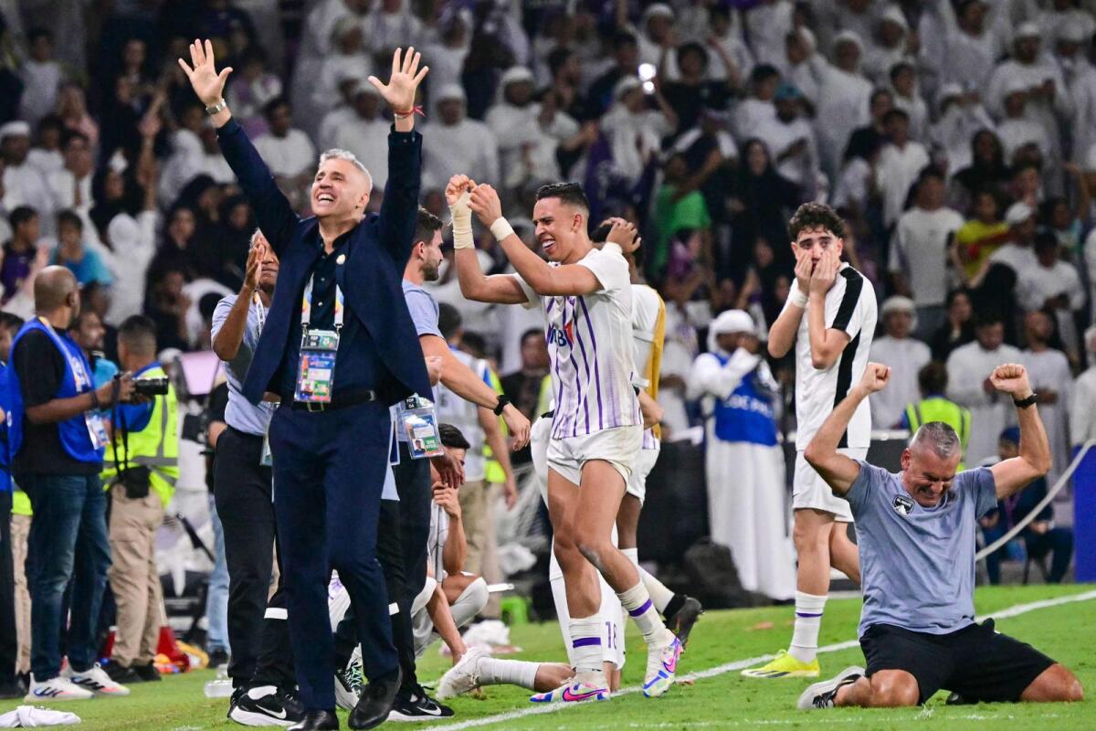 Al Ain's Argentine coach Hernan Crespo and players celebrate after the team won the Asian Champions League final against Japan's Yokohama F. Marinos at the Hazza bin Zayed Stadium. — AFP
