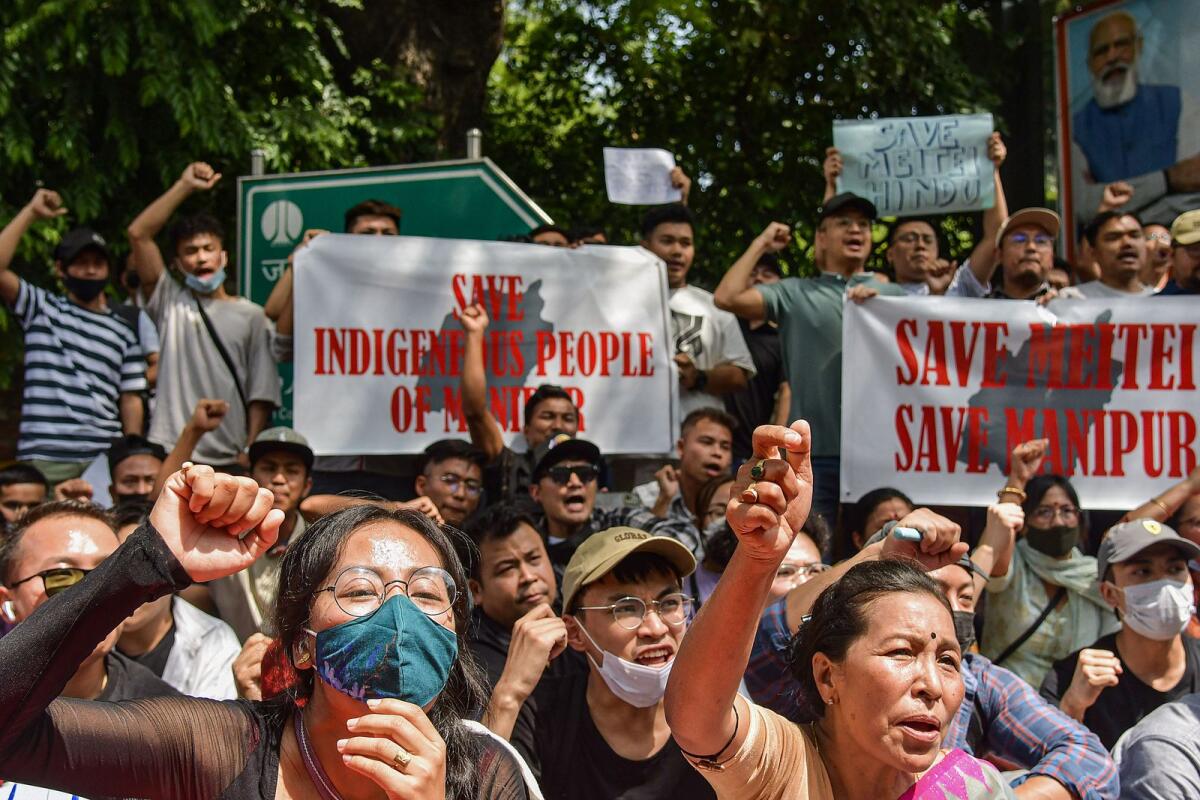People from Manipur raise slogans during their protest against the ongoing violence in their state at Jantar Mantar in New Delhii on Saturday. Photo: PTI