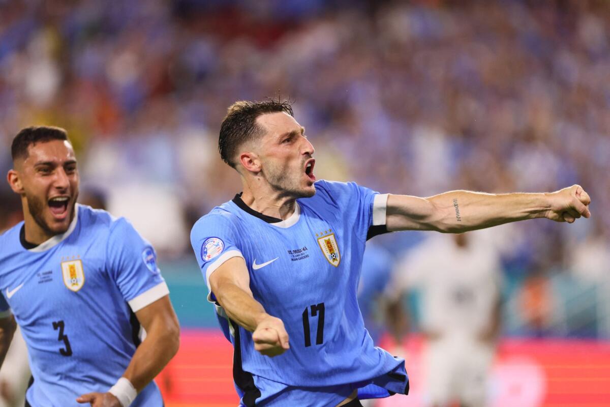 Uruguay defender Matias Vina (17) celebrates after scoring against Panama. — Reuters