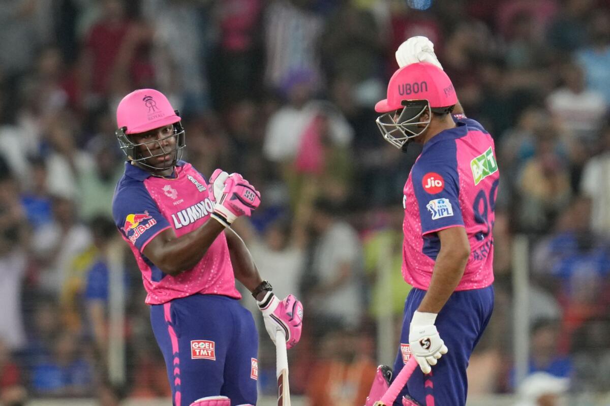 Rovman Powell and R. Ashwin of Rajasthan Royals celebrate their win over Royal Challengers Bengaluru. — IPL
