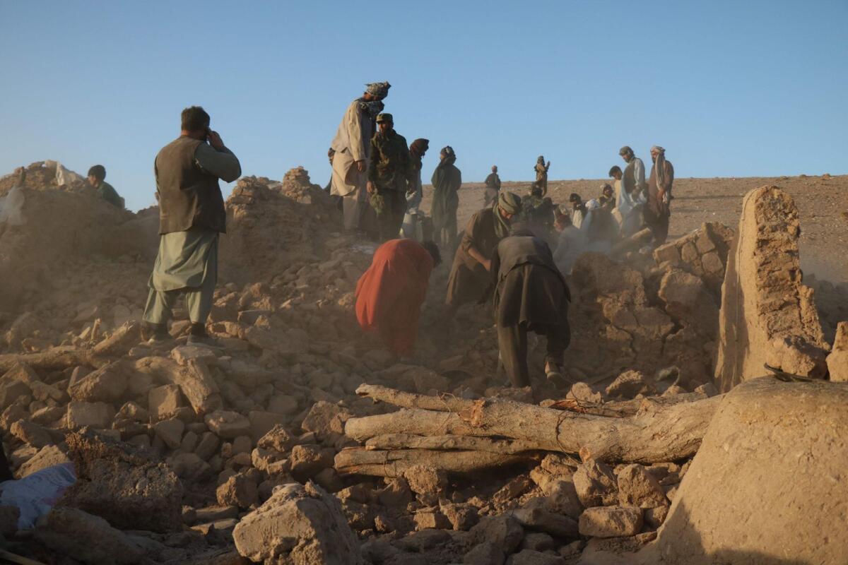 Afghan residents clear debris from a damaged house after earthquake in Sarbuland village of Zendeh Jan district of Herat province on October 7,2023. Photo: AFP