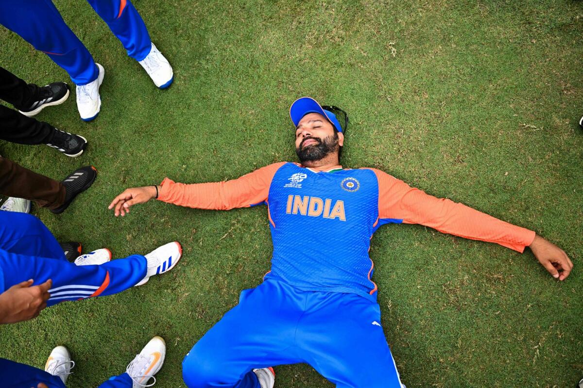 India's captain Rohit Sharma lays on the ground after winning ICC Twenty20 World Cup final against South Africa. — AFP