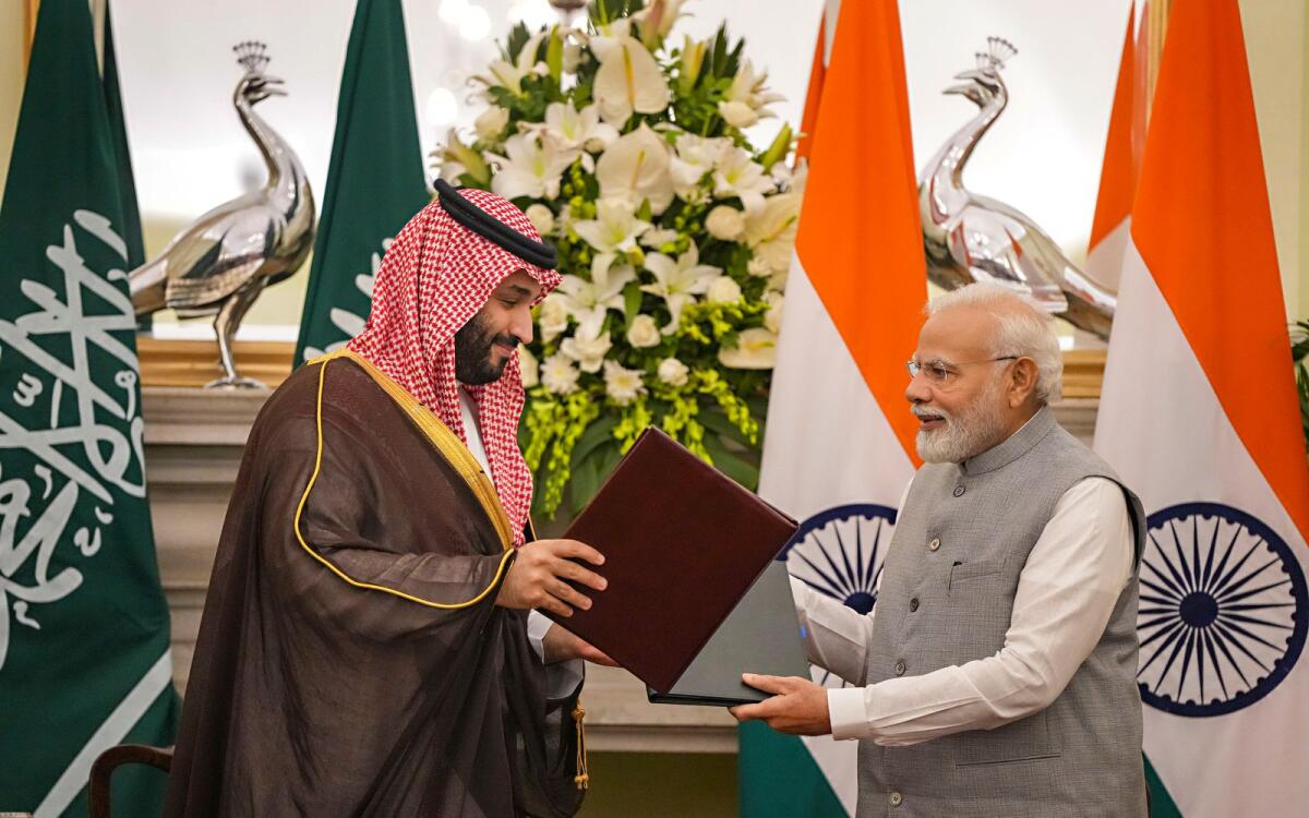 Prime Minister Narendra Modi and Saudi Arabia's Crown Prince Mohammed bin Salman during signing of minutes of the first meeting of India-Saudi Arabia Strategic Partnership Council at the Hyderabad House in New Delhi on Monday. — PTI