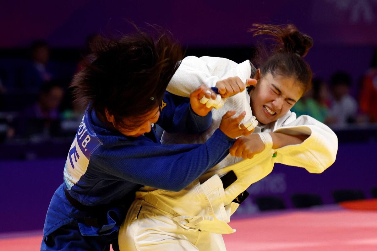 UAE's Bishrelt Khorloodoi and Uzbekistan's Diyora Keldiyorova in action during the women 52kg final at the Asian Games. — Reuters