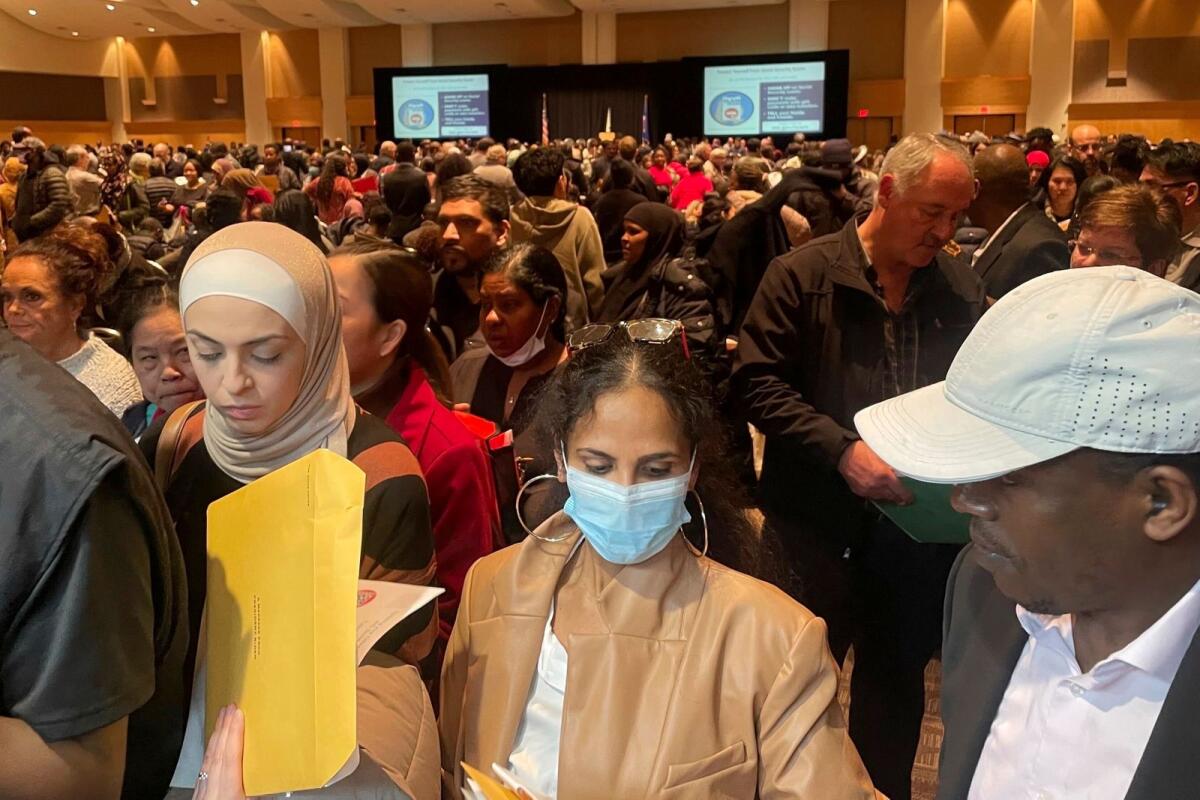 Hundreds of people become US citizens during a naturalisation ceremony at a convention center in Saint Paul, Minn., on March 9, 2023. – AP