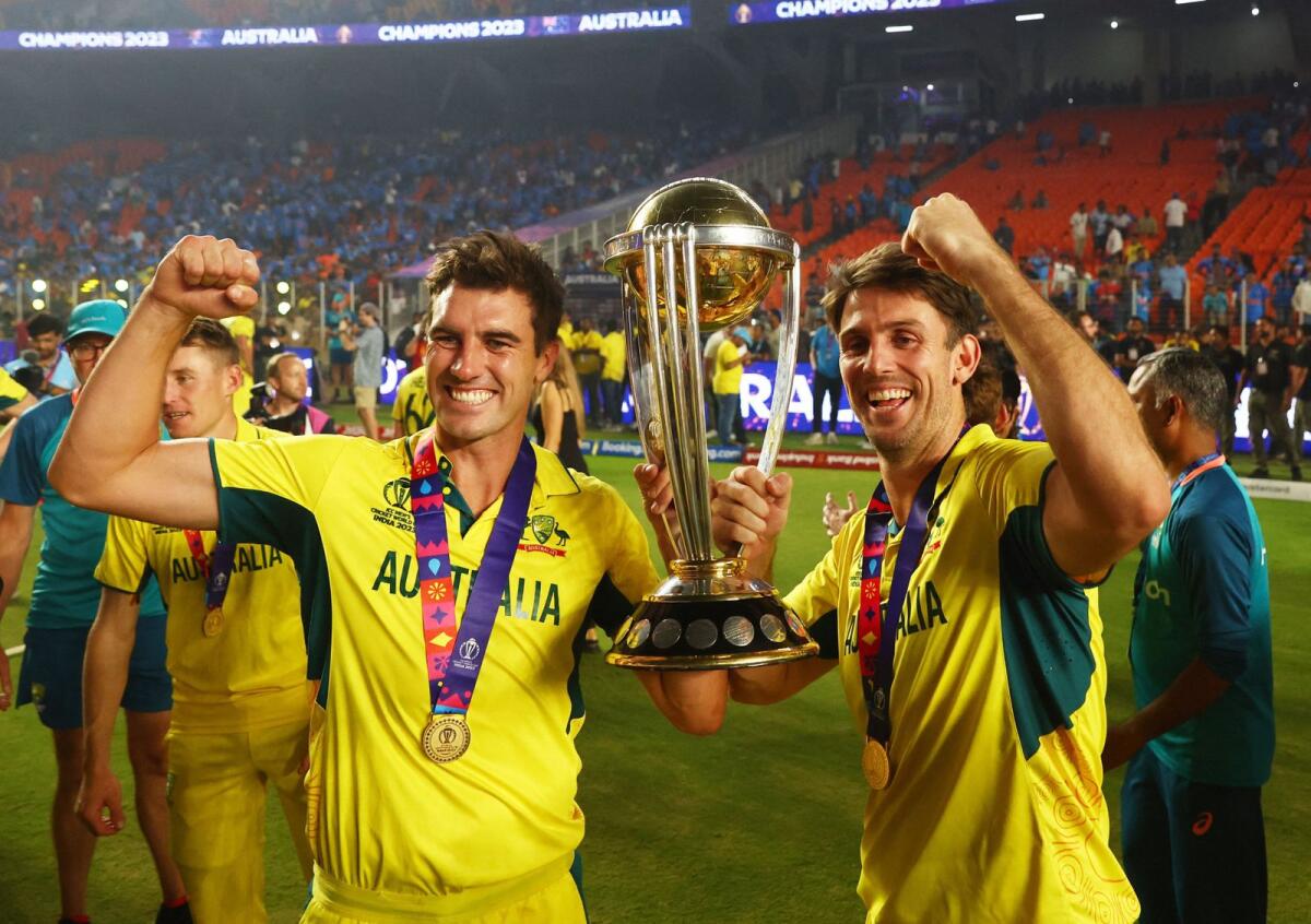 Australia's Pat Cummins and Mitchell Marsh celebrate with the trophy after winning the World Cup final against India. — Reuters