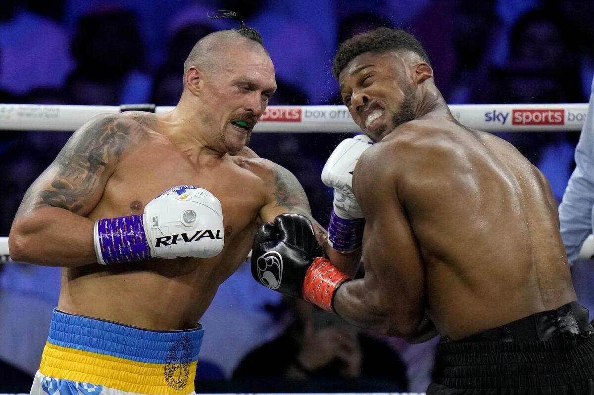 Ukraine's Oleksandr Usyk  connects with a viscious left to the jaw of Britain's Anthony Joshua,during their world heavyweight title fight in Saudi Arabia on Aug. 21, 2022. Usyk won on a split points decision. - AP