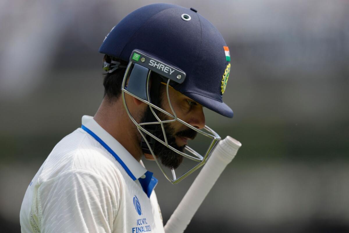 India's Virat Kohli walks off the pitch after losing his wicket. — AP