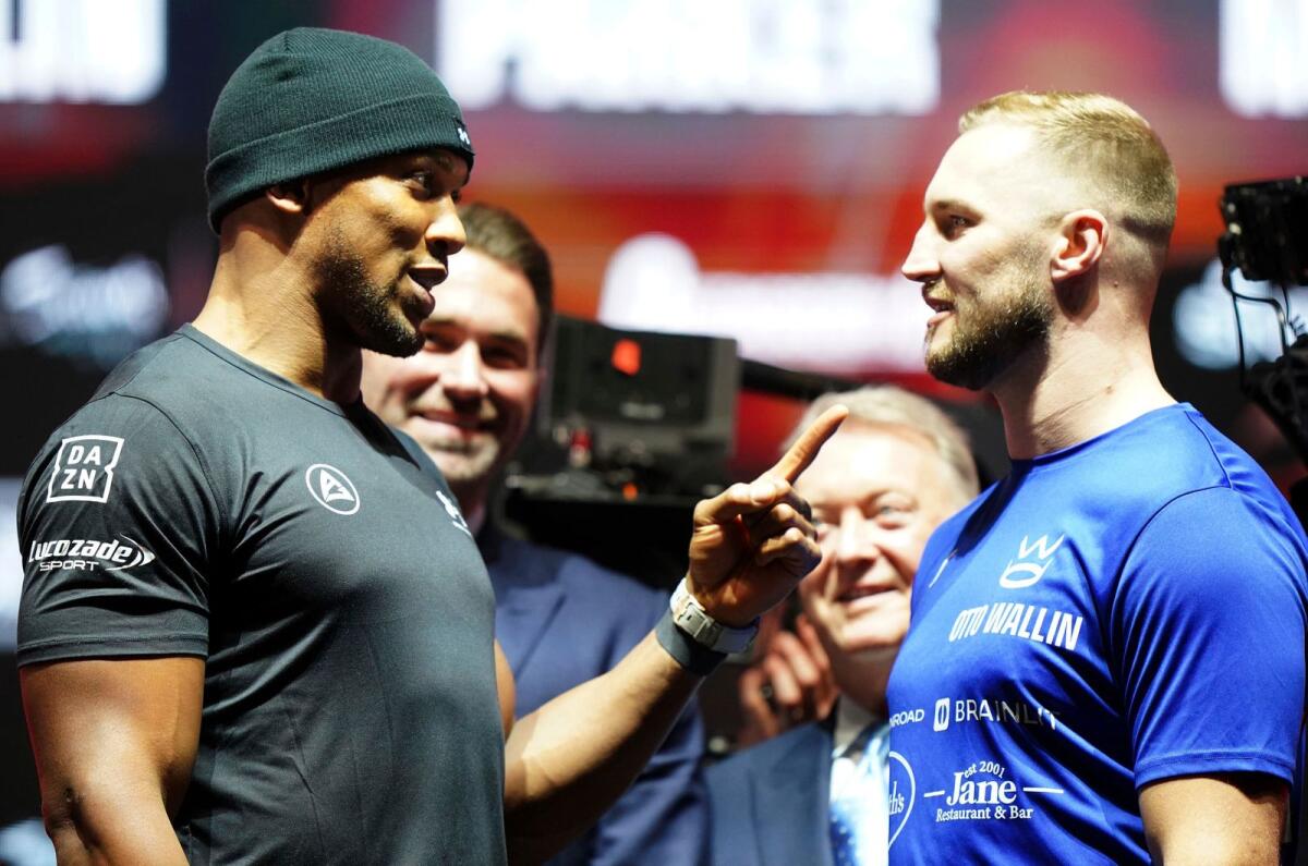 Anthony Joshua, (L) and Sweden's Otto Wallin during the face off. - AP