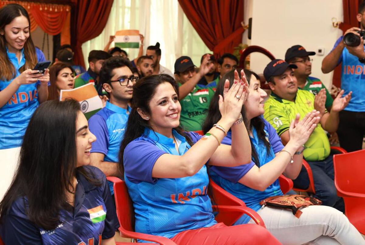 India and Pakistan fans clap as they watch the ICC T20 World Cup clash between the two teams at Anis Sajan's residence in Dubai. — Supplied photo