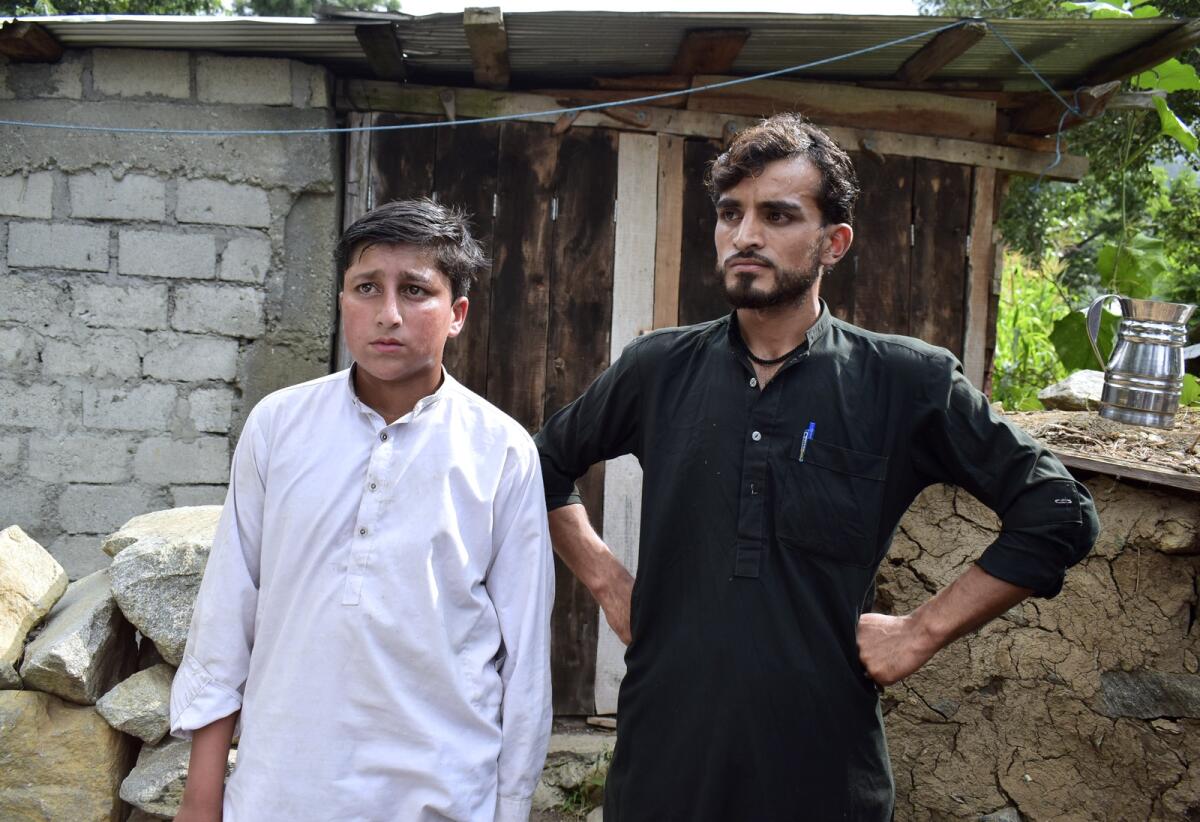 Gul Faraz (right) and Rizwan Ullah, survivors of the cable car incident. — AP