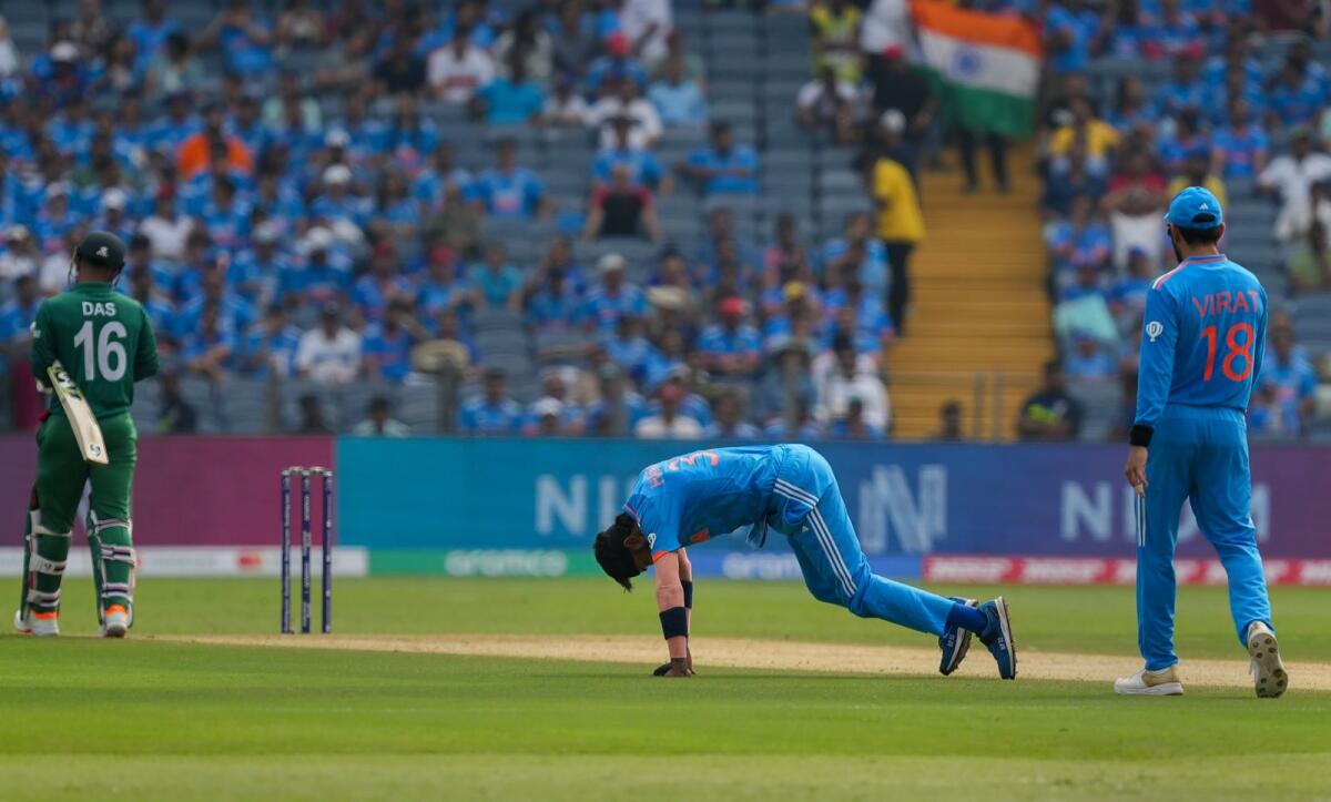 India's Hardik Pandya reacts after he suffered an injury during the ICC Men's Cricket World Cup 2023 match. Photo: PTI