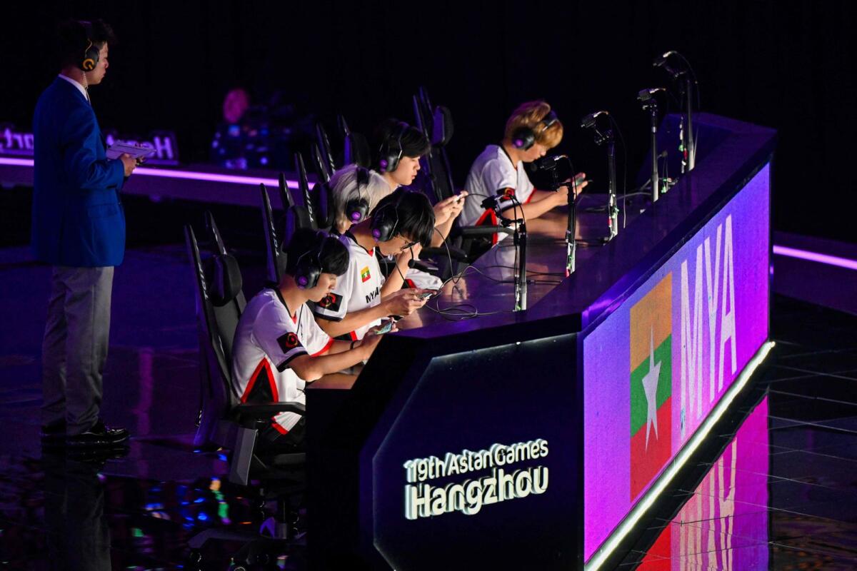 China eSports players participate in the quarterfinal game against Myanmar. — AFP
