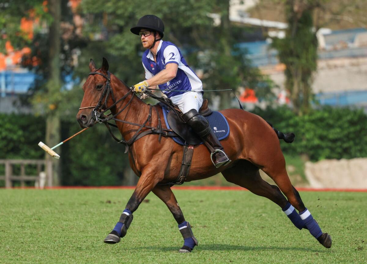 Britain's Prince Harry, the Duke of Sussex, plays in the Sentebale ISPS Handa Polo Cup at the Singapore Polo Club, in Singapore. - Reuters