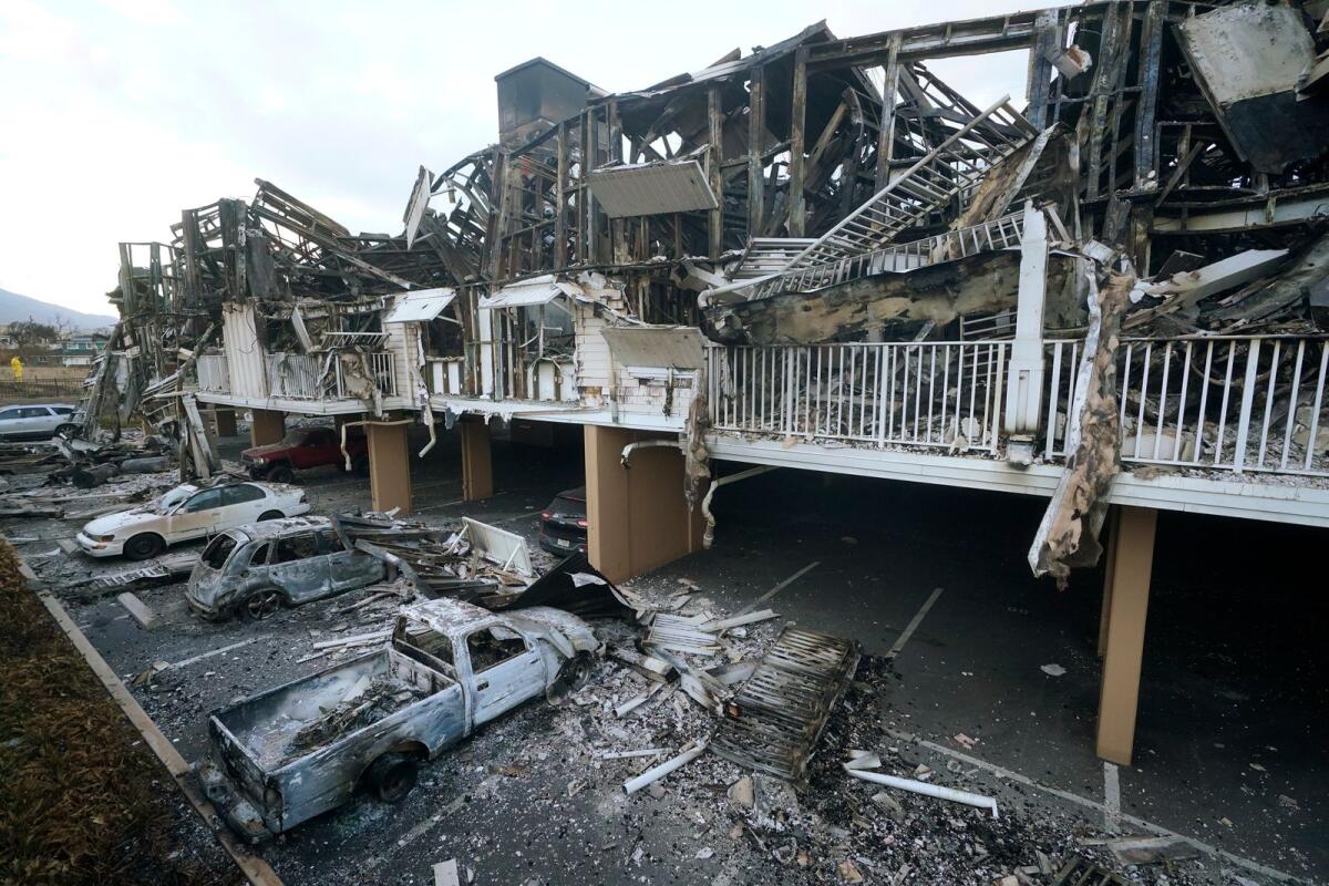 Wildfire wreckage is shown on Aug. 11, 2023, in Lahaina, Hawaii. When the town of Lahaina, which was leveled by wildfire in August, is rebuilt, local residents who survived the conflagration might not be able to afford to live there, leading economists warned on Sept. 22, 2023. -- AP file
