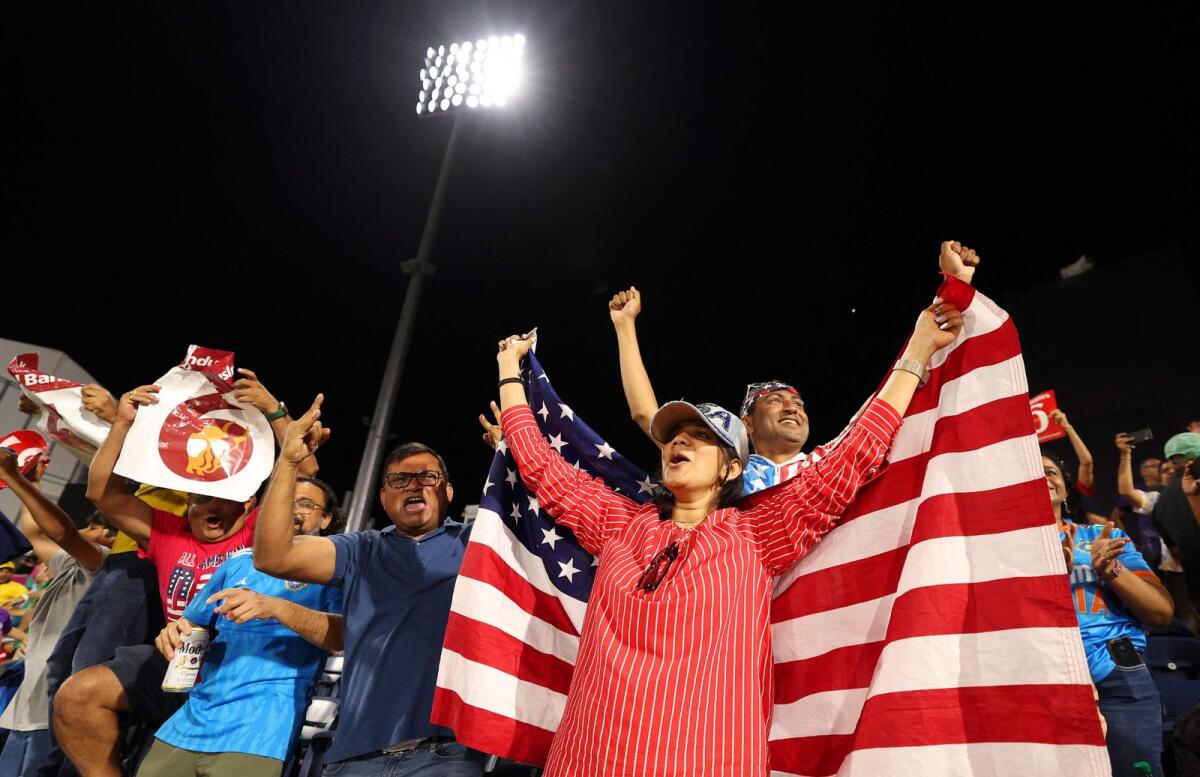 Fans enjoy the atmosphere during the match at Grand Prairie Cricket Stadium. — AFP