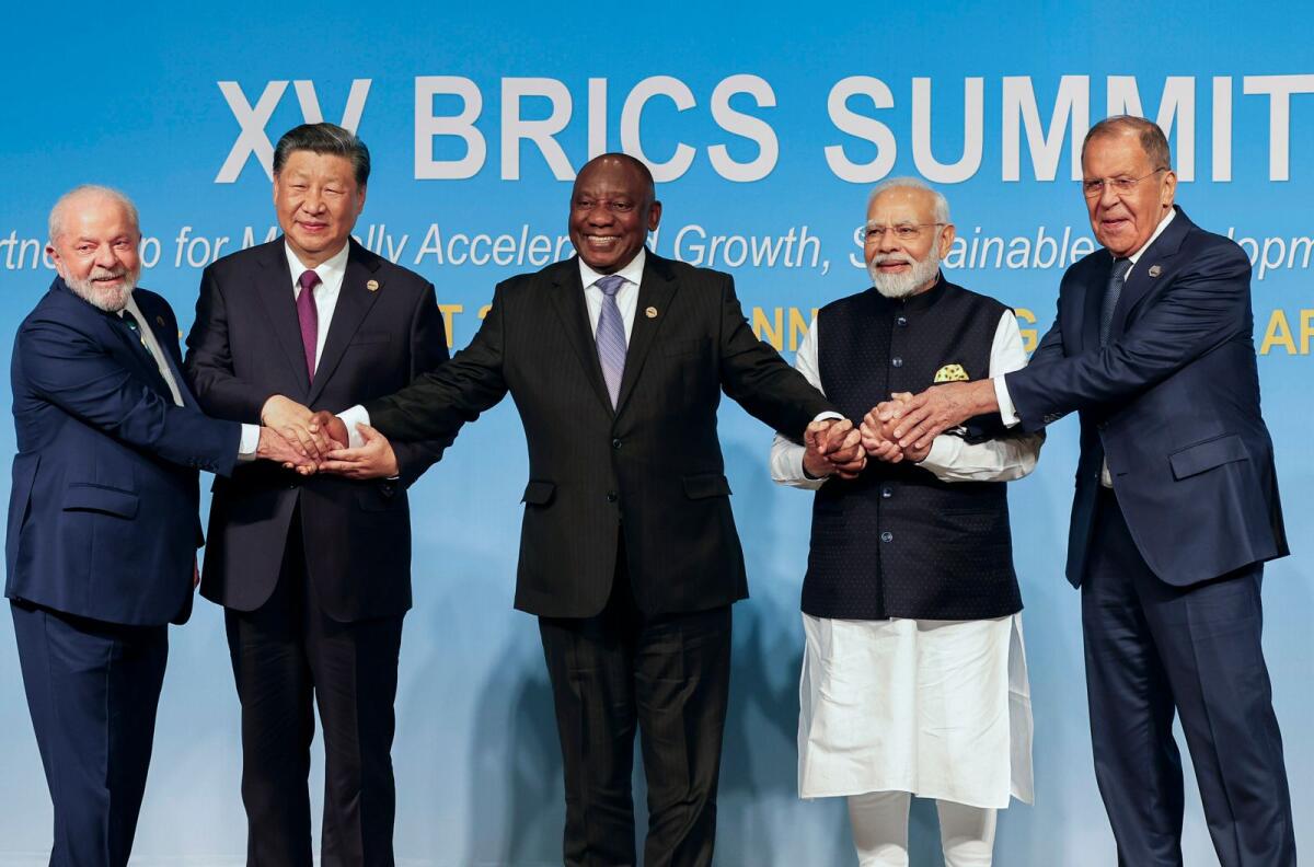 From left, Brazil's President Luiz Inacio Lula da Silva, China's President Xi Jinping, South Africa's President Cyril Ramaphosa, India's Prime Minister Narendra Modi and Russia's Foreign Minister Sergei Lavrov pose for a Brics group photo during the 2023 Brics Summit at the Sandton Convention Centre in Johannesburg, South Africa, on August 23, 2023. — AP