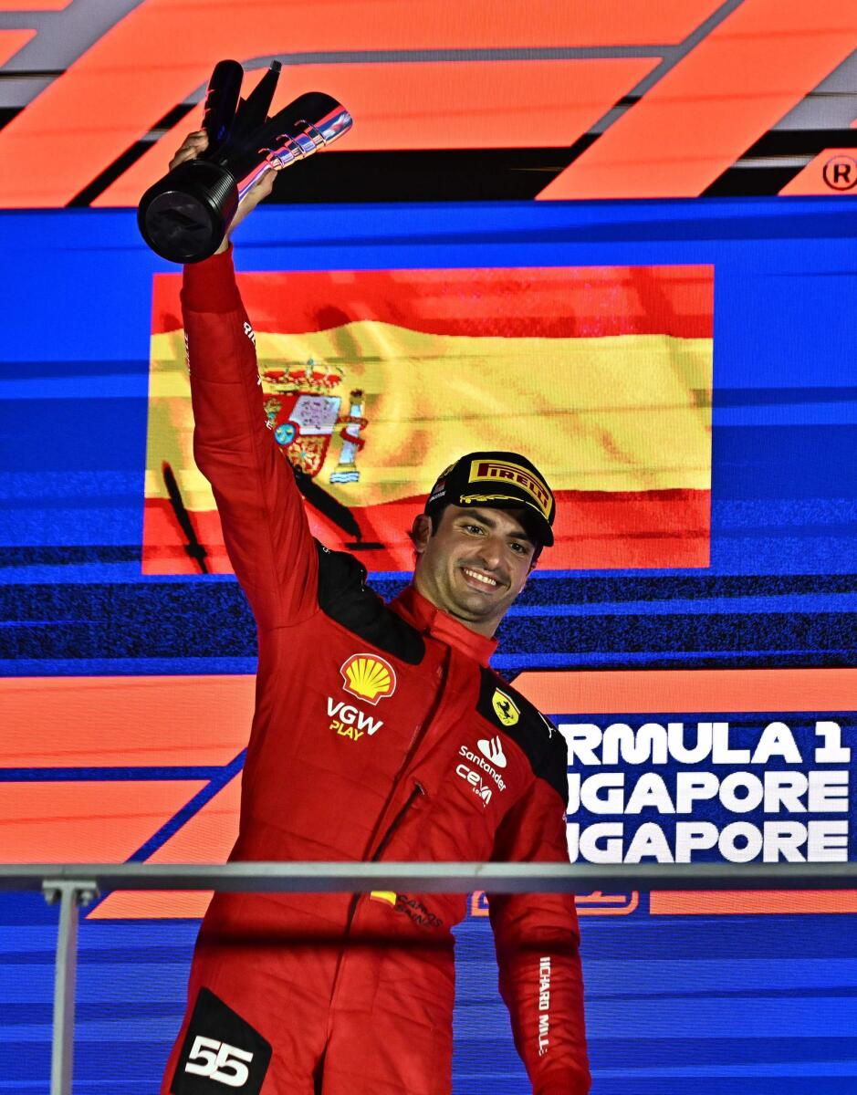 Ferrari's Spanish driver Carlos Sainz Jr celebrates on the podium. — AFP