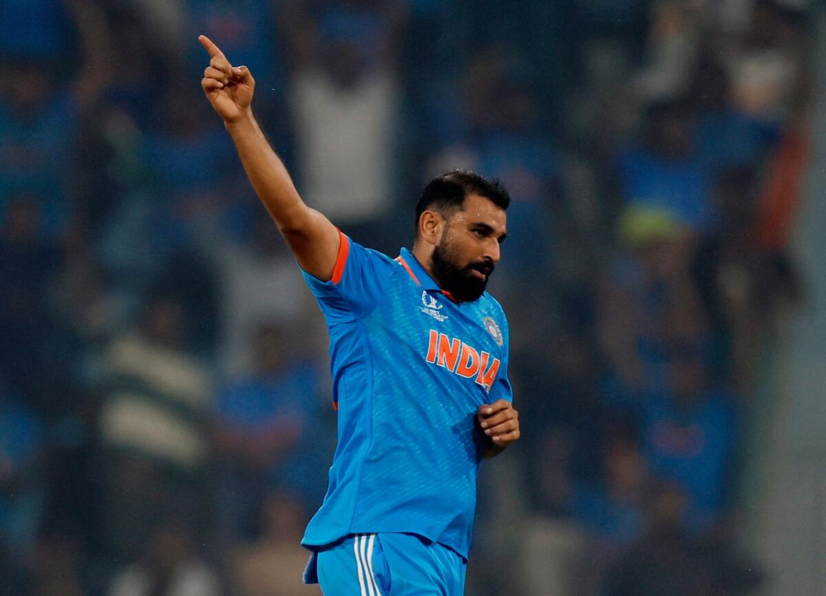 India's Mohammed Shami celebrates after taking the wicket of England's Adil Rashid. Photo: Reuters