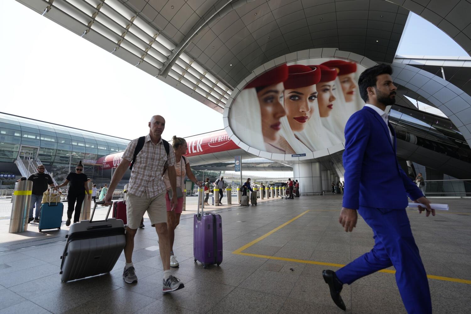 Passengers arrive at the Dubai Airport terminal 3. Photo: AP