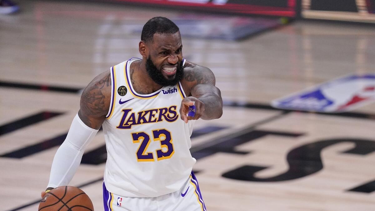 Los Angeles Lakers' LeBron James (23) directs the offence during the second half of an NBA conference semifinal playoff basketball game against the Houston Rockets