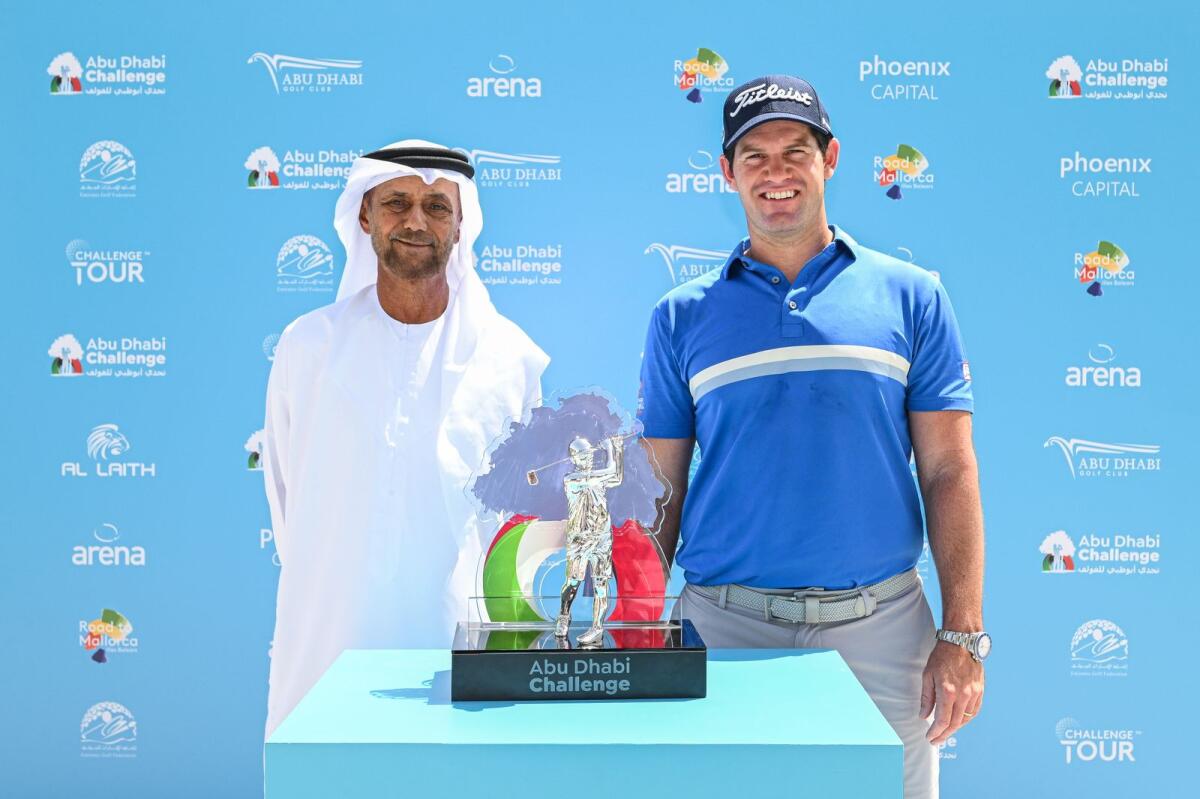 Sheikh Fahim bin Sultan Al Qasimi, chairman of the Emirates Golf Federation, and Ricardo Gouveia of Portugal pose with the trophy. — Supplied photo
