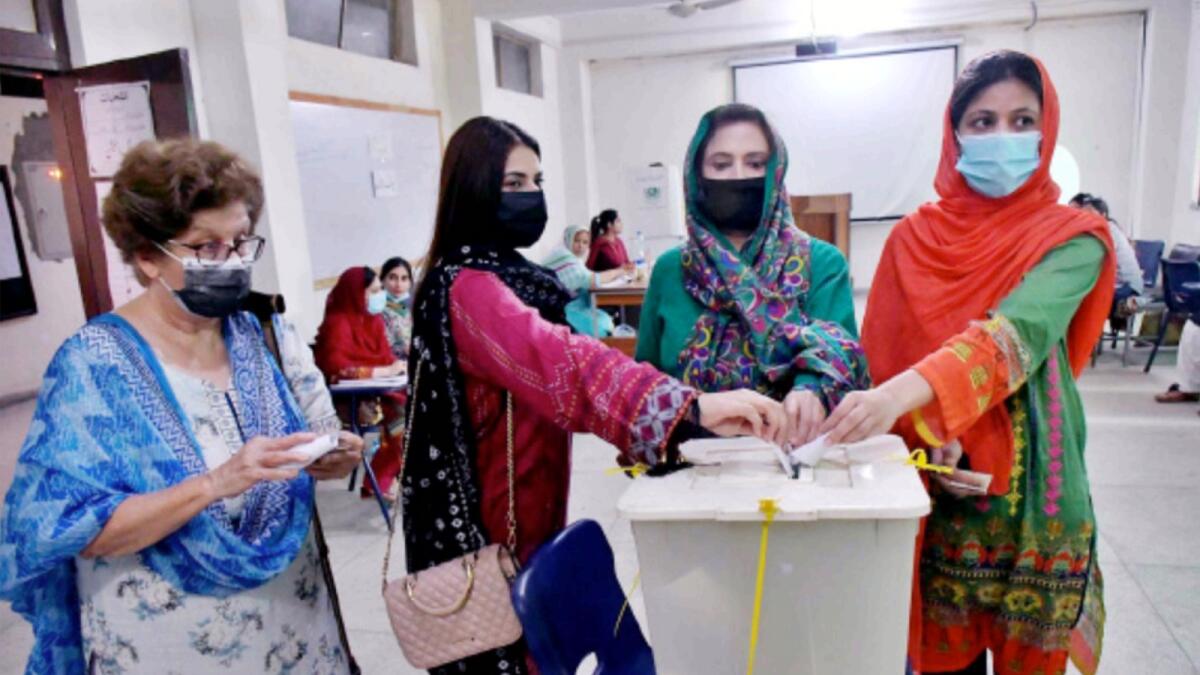 Voters cast their votes during Punjab by-election. — APP