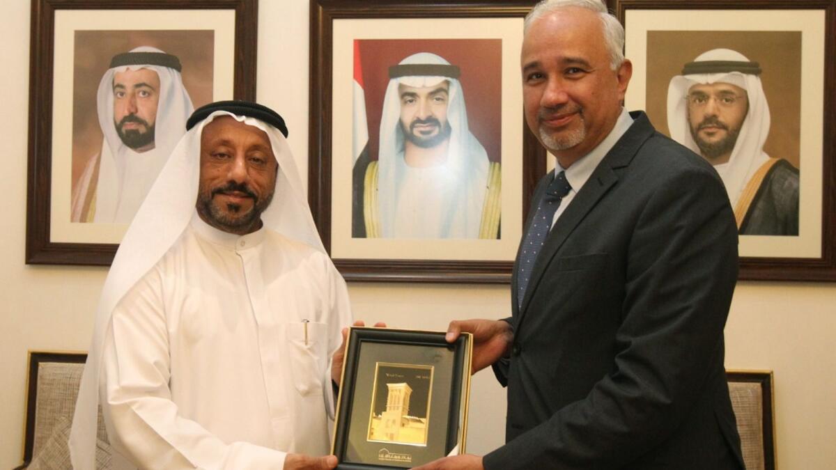 Pakistan Ambassador to the UAE Faisall Niaz Tirmizi receiving a memento from chairman of SCCI Abdullah Sultan Al Owais in Sharjah. — Supplied photo 