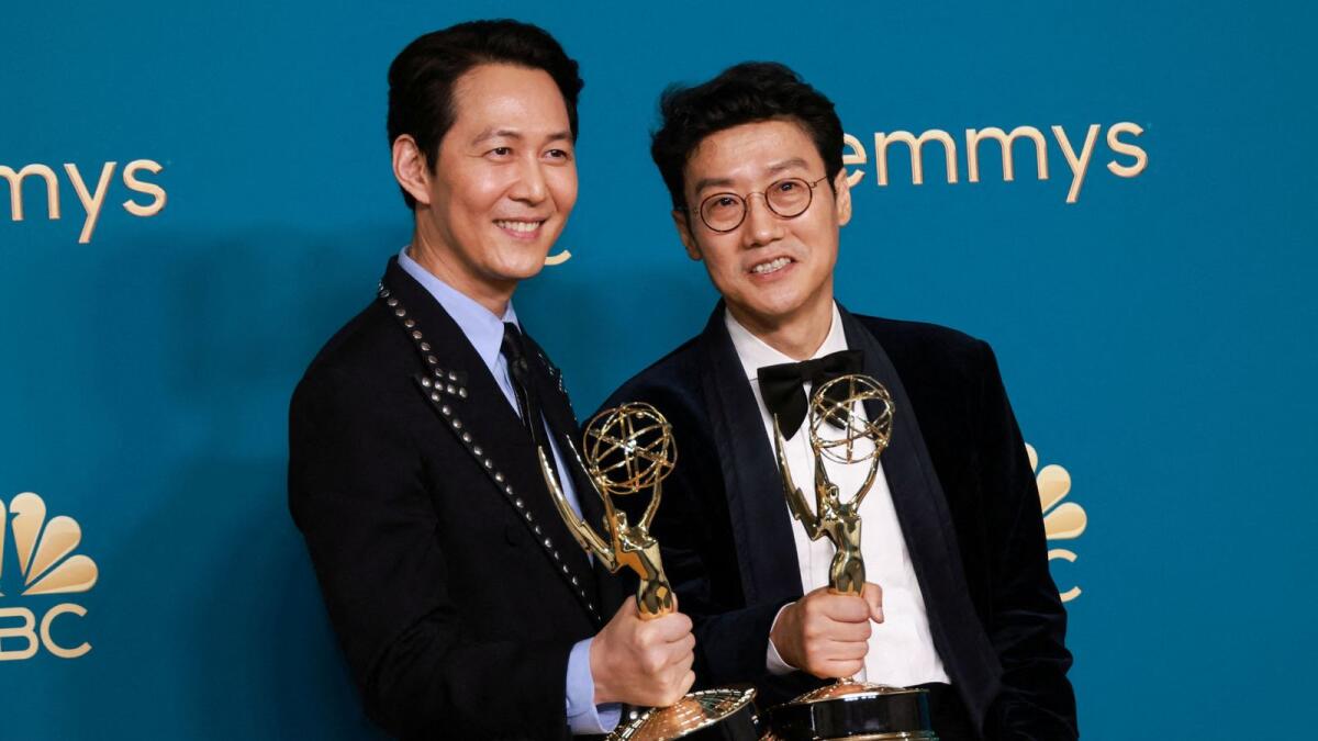Lee Jung-jae holds his Emmy for Outstanding Lead Actor In A Drama Series and Hwang Dong-hyuk, for his Outstanding Directing For A Drama Series for Squid Game at the 74th Primetime Emmy Awards