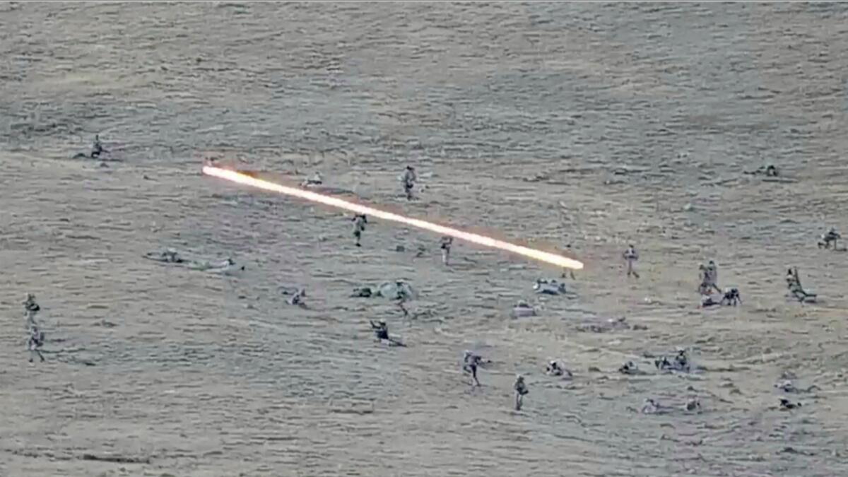 An image taken from a YouTube footage released by Armenian Defence Ministry shows Azerbaijanian servicemen crossing the Armenian-Azerbaijani border and approaching the Armenian positions. — AP