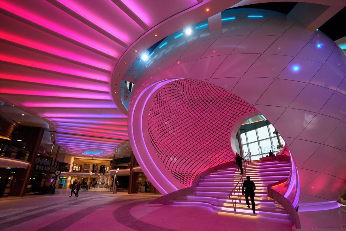 Employees and visitors walk in the Royal Promenade area of Icon of the Seas on January 11, 2024, at PortMiami in Miami. — AP