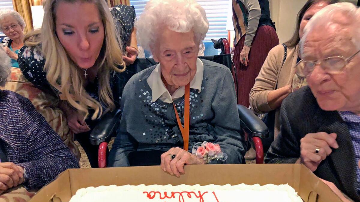 Thelma Sutcliffe is shown with a birthday cake in October 2019, in Omaha, Nebraska.