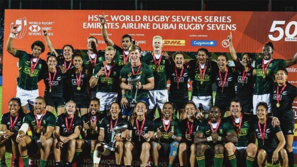 The South Africa (men) and New Zealand (women) teams celebrate with their trophies in Dubai. - KT file