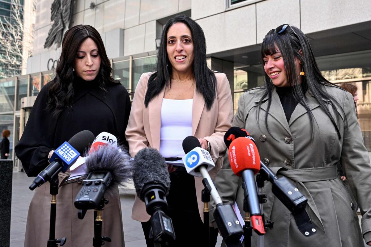 Sisters Nicole Meyer, Elly Sapper, and Dassi Erlich speak to the media outside the County Court in Melbourne on Thursday after ex-headmistress Malka Leifer was sentenced to 15 years in jail for sexually abusing Dassi and Elly at an Australian Jewish school, before fleeing to Israel then being extradited back. — AFP