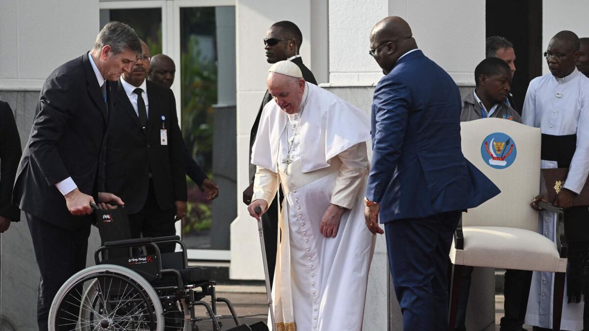Pope Francis is welcomed by President of the Democratic Republic of the Congo (DRC) Felix Tshisekedi (C-R) at the Palais de la Nation in Kinshasa, DRC, on Tuesday.— AFP
