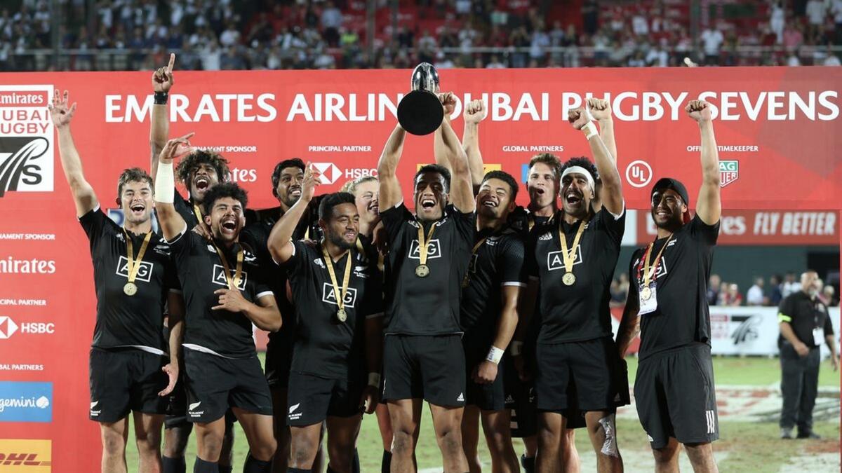 New Zealand players celebrate with the trophy after beaitng the United States in the Cup final at the Dubai Rugby Sevens in Dubai in 2018. - Reuters file