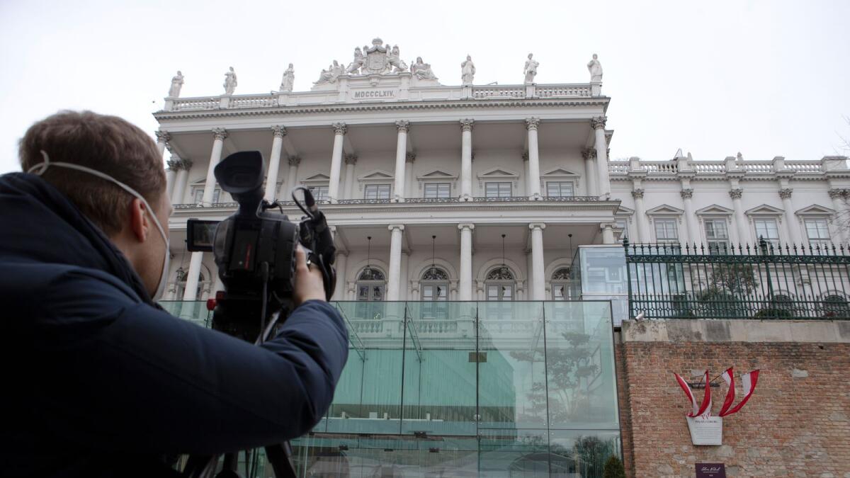 A cameraman films the Hotel Palais Coburg in Vienna, venue of diplomatic talks on Iran's nuclear programme. — AFP