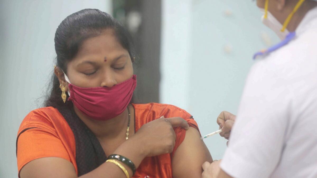 A health worker receives Covid-19 vaccination in Mumbai. — AP