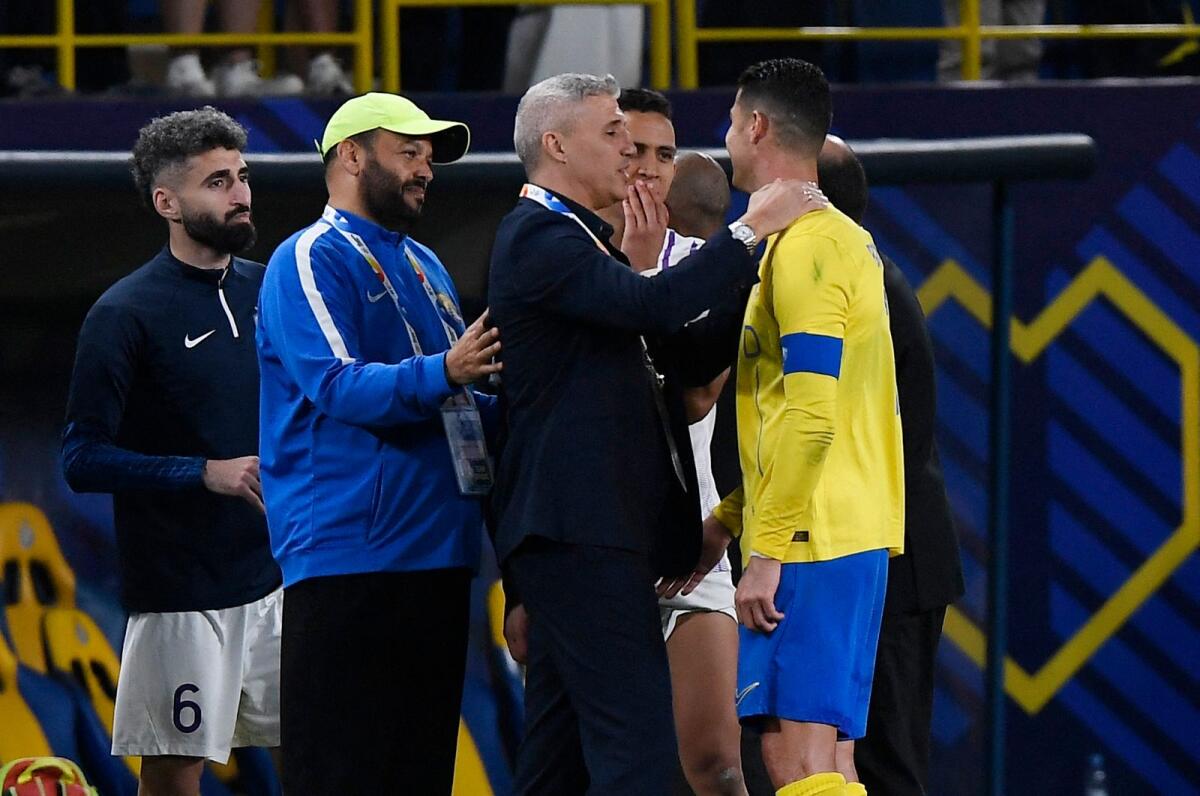 Al Nassr's Cristiano Ronaldo with Al Ain coach Hernan Crespo after the match. —  Reuters
