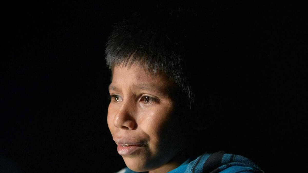 Unaccompanied Guatemalan child immigrant Oscar (12) after disembarking from a boat near the US border city of Roma.